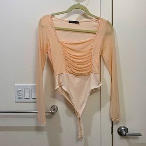 Nasty Gal Mesh Bodysuit US Size 6. Worn once. No tags. Looks like never work.